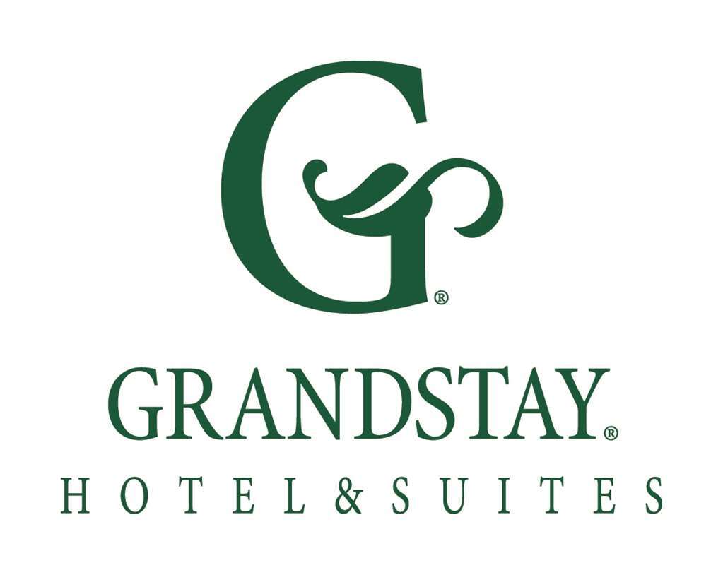 Grandstay Hotel & Suites Of Травърс Сити Лого снимка